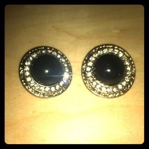 Clip on black earrings.