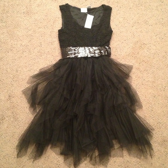 Flirty party dress (belt not included). NWT