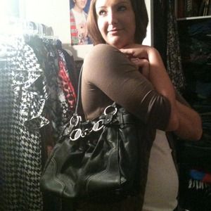 Black leather hold accented handbag