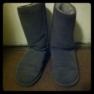 gray leather and sheepskin lining bear paws boots