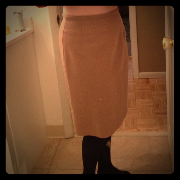 Beige knee length wool skirt.