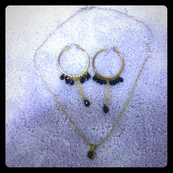 Gold necklace an earrings with black jewels