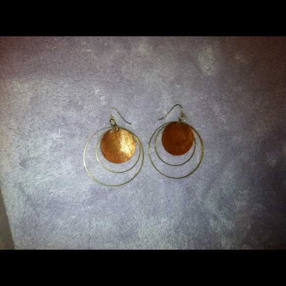 Gold earrings with circle hang design