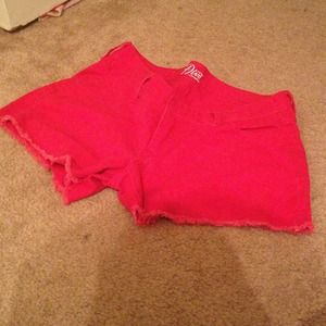 Red cutoff shorts