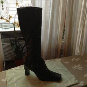 Black vinyl boot with buckle .