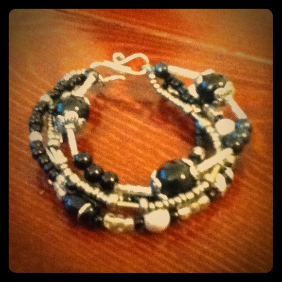 4 strand black and silver bracelet.