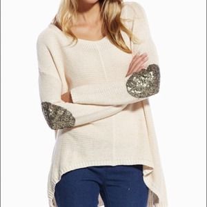 Sweater with elbow patches.
