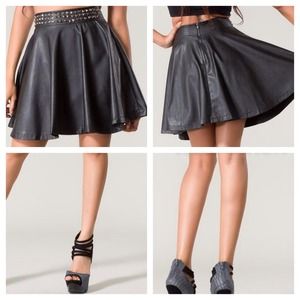 Studded pleated black skirt.
