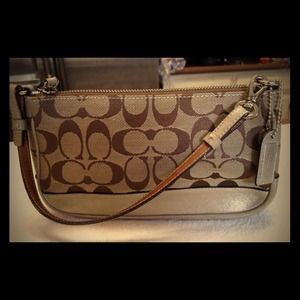 Coach clutch with gold leather accents