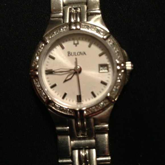 Reserved for @acjack.  Silver Bulova watch