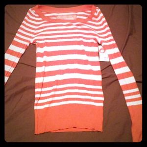 Striped orange and cream sweater.
