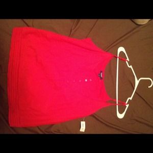 Red tank top with button front.