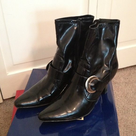 Black boot with silver buckle accent. 3 1/2" heel