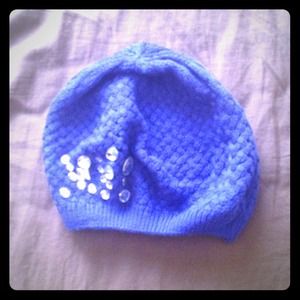 Blue hat with stones.