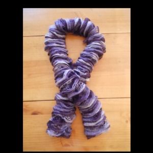 Hand knitted ruffle scarf.
