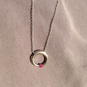 Sterling silver necklace with small ruby center.