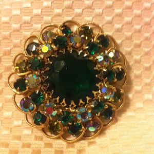 Gold and green broach
