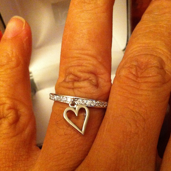 Silver Cupid eternity ring.