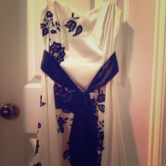 A satin and black lace detail strapless dress