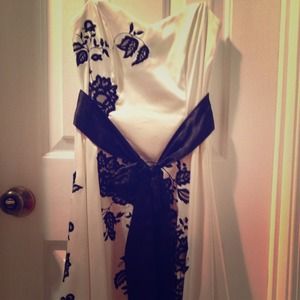 A satin and black lace detail strapless dress