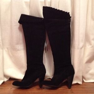 Black suede knee high boots.