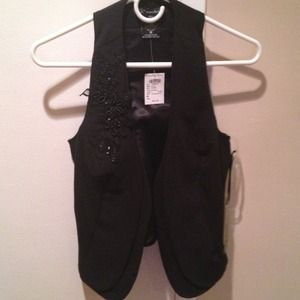 Brand new with tags. Classy vest