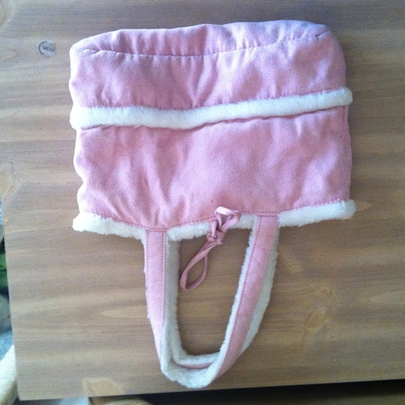 I am selling a pink and white fuzzy purse