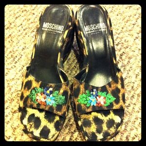 Moschino leopard open toe slides.
