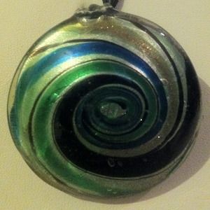 Swirls of Colors Pendant on black cord necklace.
