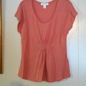 Peach shirt.