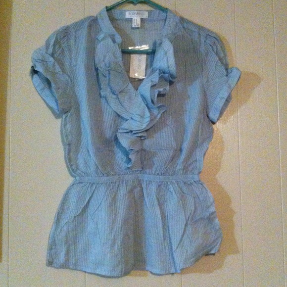 Pretty light blue ruffled blouse.