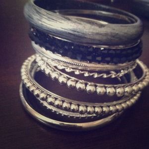 10 black and silver bracelets