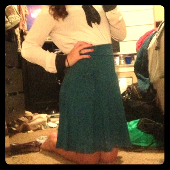 Dark, teal skirt.