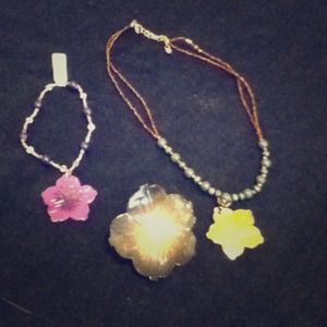 A flower bracelet, pin, and matching necklace