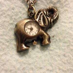 Elephant clock necklace.