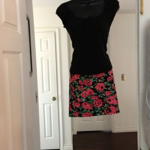 Mini skirt and black shirt.