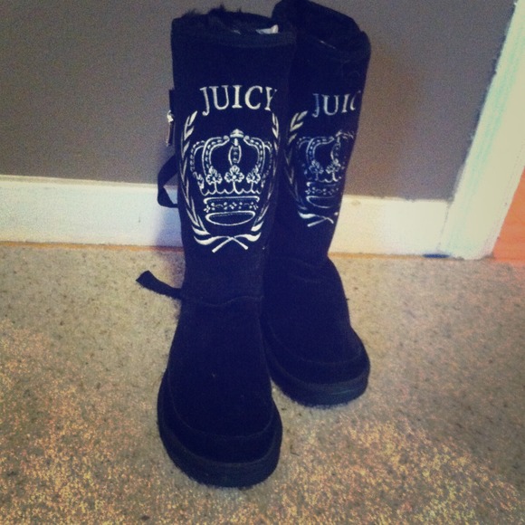 Holding Juicy Couture Ugg Boots