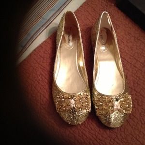 Gold glitter and beaded flats with bow detail
