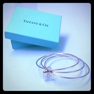 Tiffany & Co Jewelry - TIFFANY & CO TRIPLE BANGLE WITH TIFFANY LOCK CHARM Tiffany & Co Jewelry - TIFFANY & CO TRIPLE BANGLE WITH TIFFANY LOCK CHARM