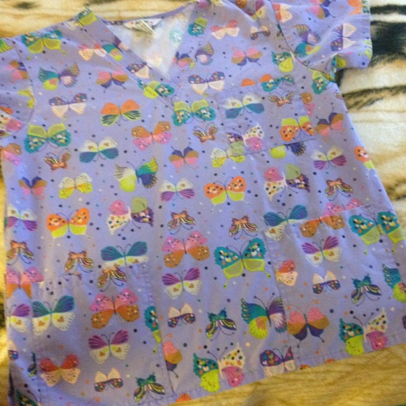 purple scrub top with colorful butterflies