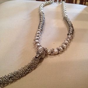 Long silver and pearl necklace and earrings