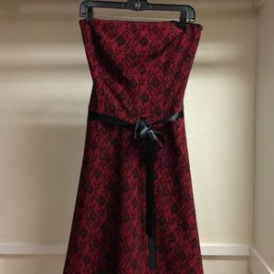 Charlotte Russe Dresses & Skirts - Red dress w/black lace print. Black ribbon tie. Charlotte Russe Dresses & Skirts - Red dress w/black lace print. Black ribbon tie.