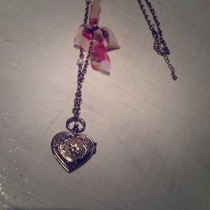 Gold heart necklace.