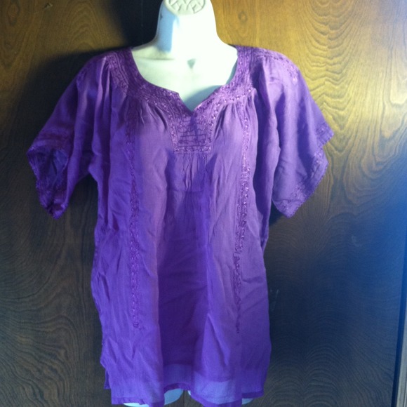 Lavender top with embroidery.