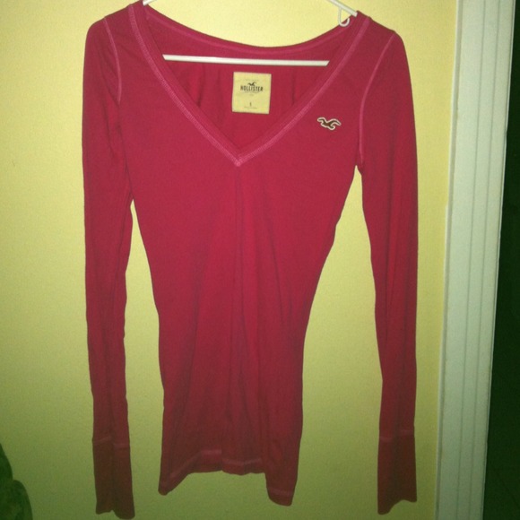 A hot pink long sleeve v-neck shirt