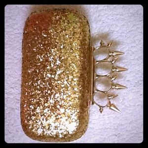 Gold glitter spike nuckle clutch