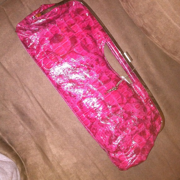 Fuschia pink snake skin oversized clutch purse.