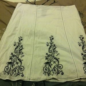 *Reserved* White cotton with black embroidery.