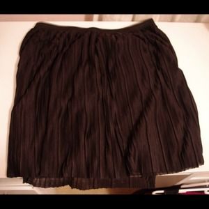 Black pleated skirt.