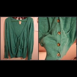 Turquoise cardigan.